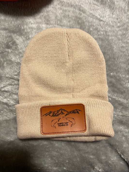 Cream colored beanie leather patch