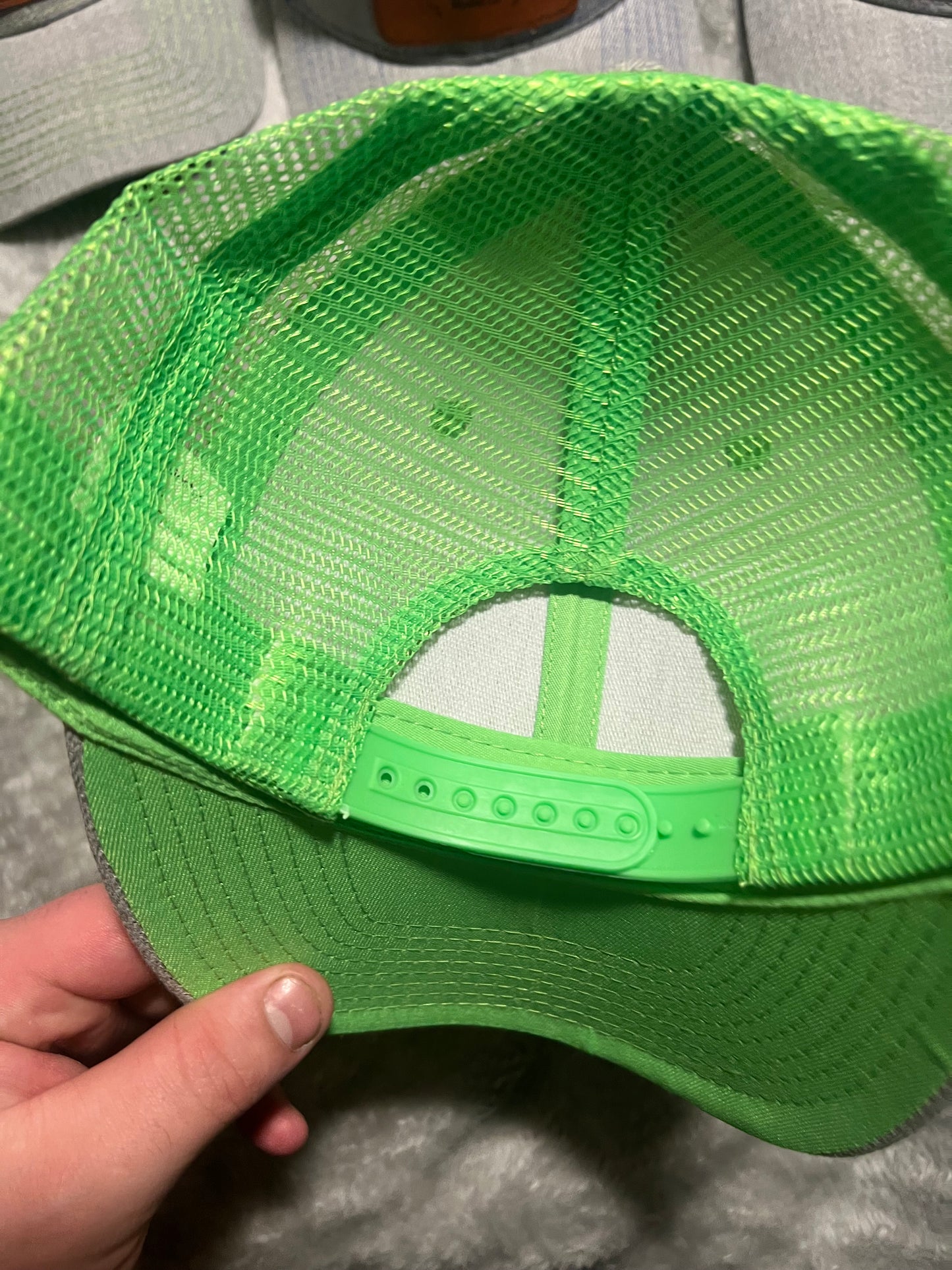 Grey and green hat